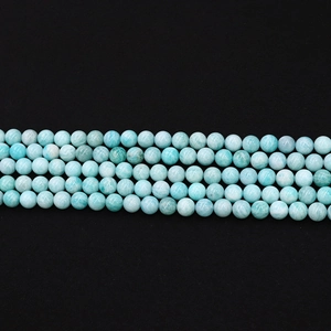 Detailed view of polished 4-10mm natural light blue amazonite round beads for DIY jewelry