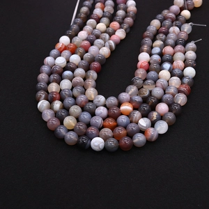 Macro shot of polished colorful striped natural agate beads for DIY jewelry making
