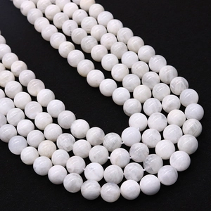 Polished natural moonstone round beads strands for DIY jewelry making on black background