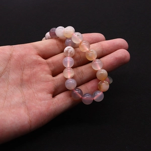 Macro view of multi-color cherry blossom agate beads with natural patterns and textures