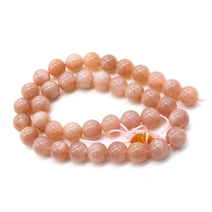 Natural 8-10mm pink sunstone round beads for DIY jewelry making on white background