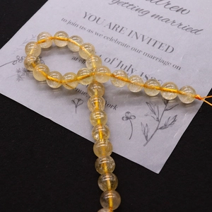 Detailed view of 8mm yellow crystal round beads with natural textures for DIY jewelry making