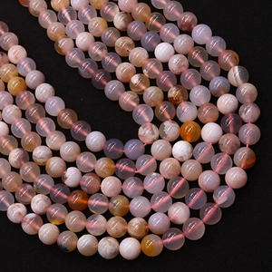 Polished cherry blossom agate round beads with natural pink and white floral mineral patterns