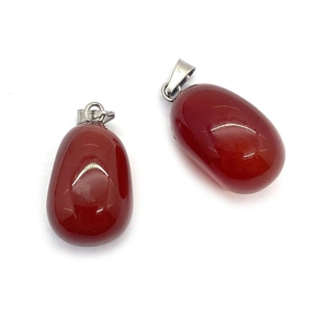 Set of two polished red agate stone pendants with silver metal bails on white background