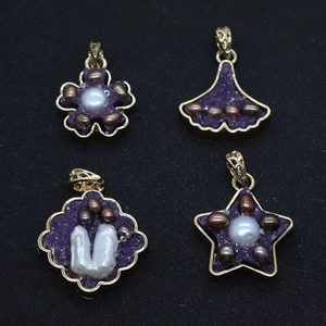 Detail view of four crystal pendants with pearls and gold-plated zinc alloy frames