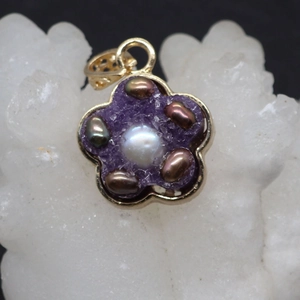 Elegant natural freshwater pearl flower pendant with gold trim and purple resin crystal base