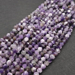 Macro detail of faceted natural purple amethyst beads for DIY jewelry making