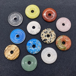 Detailed set of 12 donut-shaped natural stone pendants in various colorful styles