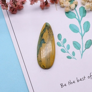 Water-drop natural imperial stone pendant with multicolor patterns on a gift display card