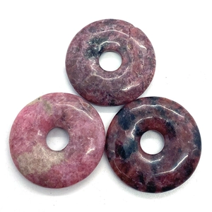 Polished pink rhodonite donut pendants with natural black mineral spots for DIY jewelry