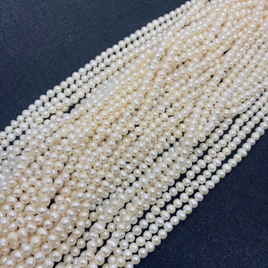 Macro shot of high-luster AAA white freshwater pearls for DIY jewelry making