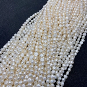 Detailed macro view of high-quality white natural freshwater pearls with natural luster