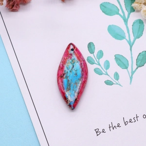 Marquise cut turquoise and pink stone pendant with gold veins on artistic card