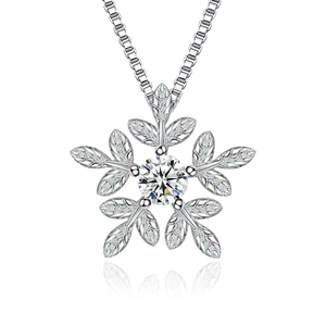Elegant silver snowflake pendant necklace with sparkling center stone and leaf details