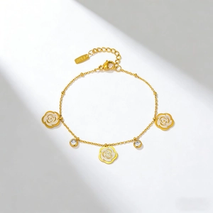 Elegant gold flower bracelet with white camellia petals and sparkling zircon stones