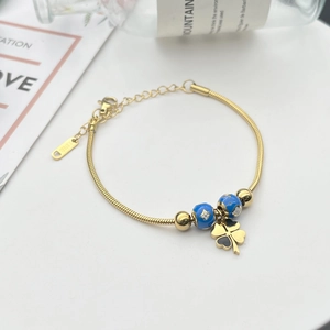 Schlangenarmband aus Titanstahl mit blauen Emailleperlen und vierblättrigem Kleeblatt