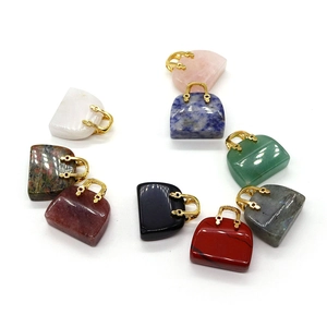 Natural gemstone mini handbag pendants with gold handles in various vibrant colors