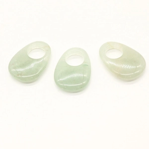 Macro view of polished green natural opal stone oval pendants for DIY jewelry making