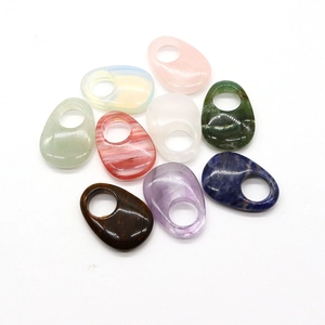 Polished teardrop-shaped natural opal and semi-precious stone rings in various colors