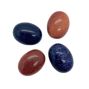 Set of four sparkling oval goldstone and blue sand stone cabochons for DIY jewelry making