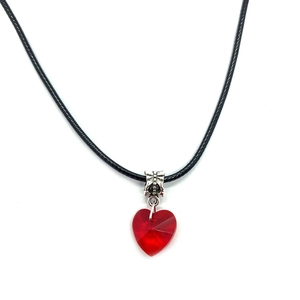Faceted red heart crystal pendant on black necklace cord with vintage silver clasp