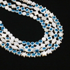 Perles en nacre naturelle avec motif œil bleu en formes d'étoiles et de fleurs