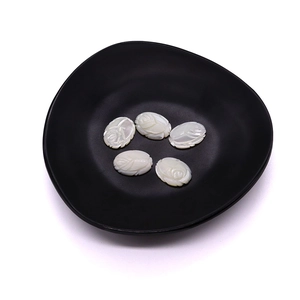 Five oval white mother of pearl shell beads with carved rose flower details