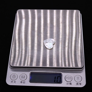 Macro view of a 1.0g heart-shaped mother of pearl shell bead for DIY jewelry making