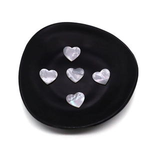 Five heart-shaped natural mother of pearl shell beads with iridescent white luster