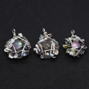 Detailed wire-wrapped black button pearl pendant with artisanal stones in boho style