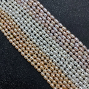 High-luster 3-7mm rice-shaped natural freshwater pearls in white, pink, and orange