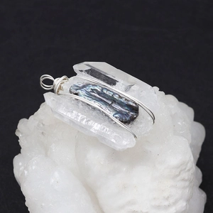 Artisan handmade pendant with purple shell and crystal column wrapped in silver wire