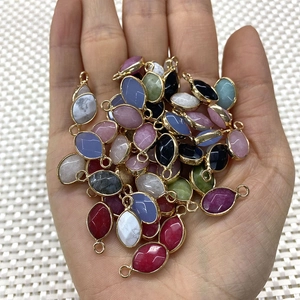 Oval black onyx and faceted natural stone pendants with gold frames for jewelry making