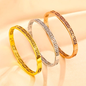 Classic 18K gold-plated stainless steel open bangles featuring Greek fret cutout patterns