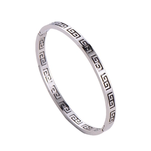 Minimalist silver stainless steel oval bangle featuring classic Greek key pattern