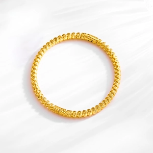 Elegant 18k gold plated titanium steel bangle with textured geometric beads design