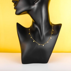 Minimalist 18k gold plated geometric tassel necklace with round charms on black bust
