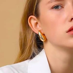 Elegant gold teardrop earrings for women with a minimalist polished metallic finish