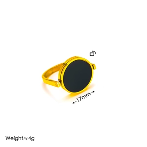 Minimalist gold plated rotating ring with black circular face and 17mm diameter disc