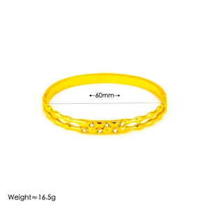 Detail view of 18k gold plated bangle with 60mm diameter and 16.5g weight specs