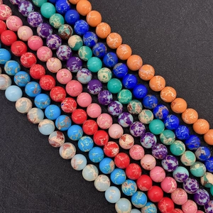 Macro view of colorful emperor stone round beads with natural marble texture for jewelry DIY