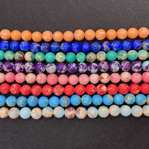 Macro shot of colorful natural imperial jasper stone beads in various vibrant shades