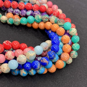Macro view of colorful natural stone round beads with polished finish for DIY jewelry