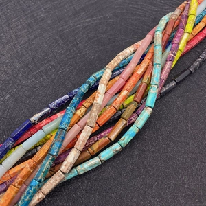 Macro shot of colorful cylindrical imperial stone tube beads for DIY jewelry making