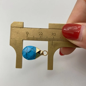 Detail showing tear-drop natural stone pendant measurement of 13mm with gold bail