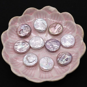 Macro shot of high luster 19-20mm coin freshwater pearls in white pink and violet hues