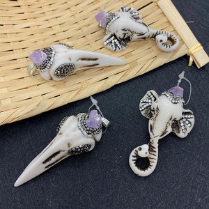 Elephant and bird skull pendants with purple crystal and resin bone carving texture