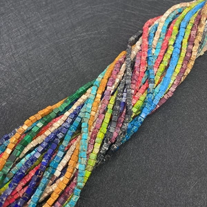 Macro shot of 3mm cubic natural emperor stone beads in vibrant multi-color strand