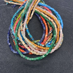 Close-up of 3mm natural emperor stone cube beads in various colors for DIY jewelry making