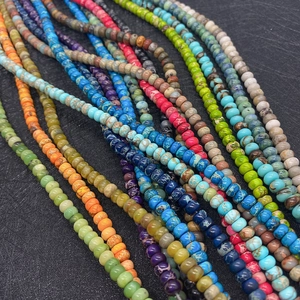 Macro shot of colorful 4x6mm natural stone imperial jasper beads with veined patterns